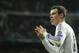 Real's Gareth Bale celebrates scoring the opening goal during a Champions League quarterfinal first leg soccer match between Real Madrid and Borussia Dortmund at the Santiago Bernabeu stadium in Madrid, Spain, Wednesday April 2, 2014. (AP Photo/Paul White)