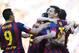 FC Barcelona's Lionel Messi, second right, reacts after scoring during a Spanish La Liga soccer match against Betis at the Camp Nou stadium in Barcelona, Spain, Saturday, April 5, 2014. (AP Photo/Manu Fernandez)
