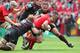 LIMERICK, IRELAND - APRIL 05: Dave Kilcoyne of Munster and Romain Millo-Chluski and Jean-Marc Doussain of Toulouse during the Heineken Cup Quarter Final match between Munster and Toulouse at Thomond Park on April 5, 2014 in Limerick, Ireland. (Photo by Patrick Bolger/Getty Images)