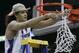 Florida's Joakim Noah (13) cutws down the net after the Gators defeated Ohio State 84-75 in the the Final Four basketball championship at Georgia Dome in Atlanta, Monday, April 2, 2007. (AP Photo/Gerry Broome)
