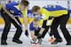 Sweden's Markus Eriksson, center, delivers the stone as teammates Christoffer Sundgren, left, and Kristian Lindstrom, right, sweep the path during a semi-final match against Canada at the 2014 World Men's Curling Championship held at the Capital Gymnasium in Beijing, China, Saturday, April 5, 2014. (AP Photo/Alexander F. Yuan)