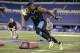 Buffalo linebacker Khalil Mack runs a drill at the NFL football scouting combine in Indianapolis, Monday, Feb. 24, 2014. (AP Photo/Michael Conroy)