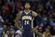 Indiana Pacers' Paul George waits for action to resume during an NBA basketball game against the Cleveland Cavaliers Sunday, March 30, 2014, in Cleveland. (AP Photo/Tony Dejak)