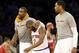 New York Knicks' Amar'e Stoudemire, left, and Jeremy Tyler, right, encourage Raymond Felton, center, during the second half of an NBA basketball game against the Washington Wizards Friday, April 4, 2014, in New York. The Wizards won the game 89-90. (AP Photo/Frank Franklin II)