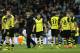 Dortmund head coach Juergen Klopp, 3rd left walks between his players at the end of a Champions League quarterfinal first leg soccer match between Real Madrid and Borussia Dortmund at the Santiago Bernabeu stadium in Madrid, Spain, Wednesday April 2, 2014. (AP Photo/Paul White)