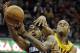 Cleveland Cavaliers' Jarrett Jack, right, fouls Charlotte Bobcats' Chris Douglas-Roberts (55) on a drive to the basket in the fourth quarter of an NBA basketball game on Saturday, April 5, 2014, in Cleveland. The Bobcats won 96-94 in overtime. (AP Photo/Mark Duncan)