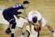 Connecticut guard Shabazz Napier (13) and Florida guard Scottie Wilbekin (5) reach for a loose ball during the second half of the NCAA Final Four tournament college basketball semifinal game Saturday, April 5, 2014, in Arlington, Texas. (AP Photo/Tony Gutierrez)