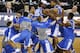Kentucky celebrates after guard Aaron Harrison made a three-point basket in the final seconds against Wisconsin to win the game 74-73 during their NCAA Final Four tournament college basketball semifinal game Saturday, April 5, 2014, in Arlington, Texas. (AP Photo/Tony Gutierrez)