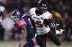 Northern Illinois safety Jimmie Ward (15) intercepts a pass intended for Toledo wide receiver Alonzo Russell (9) in the first quarter an NCAA college football game in Toledo, Ohio, Wednesday, Nov. 20, 2013. (AP Photo/Rick Osentoski)