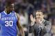 Kentucky head coach John Calipari cheers on players including forward Julius Randle (30) during the first half of the NCAA Final Four tournament college basketball semifinal game against Wisconsin Saturday, April 5, 2014, in Arlington, Texas. (AP Photo/Eric Gay)