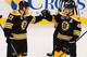 BOSTON, MA - MARCH 4: David Krejci #46 of the Boston Bruins celebrates a hat trick with teammate Milan Lucic #17 against the Florida Panthers at the TD Garden on March 4, 2014 in Boston, Massachusetts. (Photo by Steve Babineau/NHLI via Getty Images)