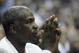 Former basketball player Charles Oakley watches the action from court-side seats during the first half of Game 2 between the Orlando Magic and Charlotte Bobcats in the first round of the NBA basketball playoffs in Orlando, Fla., Wednesday, April 21, 2010. (AP Photo/Phelan M. Ebenhack)