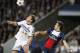 Chelsea's Branislav Ivanovic, left, wins a header in front of PSG's Edinson Cavani during the Champions League quarterfinal first leg soccer match between PSG and Chelsea, at the Parc des Princes stadium, in Paris, Wednesday, April 2, 2014. (AP Photo/Christophe Ena)