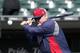 Minnesota Twins manager Ron Gardenhire hits infield practice before an opening day baseball game against the Chicago White Sox Monday, March 31, 2014, in Chicago. (AP Photo/Charles Rex Arbogast)
