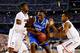 ARLINGTON, TX - APRIL 07: Julius Randle #30 of the Kentucky Wildcats goes to the basket as Amida Brimah #35 and Lasan Kromah #20 of the Connecticut Huskies defend during the NCAA Men's Final Four Championship at AT&T Stadium on April 7, 2014 in Arlington, Texas. (Photo by Ronald Martinez/Getty Images)