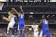 Connecticut guard Shabazz Napier shoots between Kentucky guard Dominique Hawkins (25) and guard Aaron Harrison (2) during the first half of the NCAA Final Four tournament college basketball championship game Monday, April 7, 2014, in Arlington, Texas. (AP Photo/David J. Phillip)