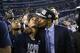 Connecticut head coach Kevin Ollie, right, kisses guard Shabazz Napier on the cheek after their 60-54 victory over Kentucky in the NCAA Final Four tournament college basketball championship game Monday, April 7, 2014, in Arlington, Texas. (AP Photo/David J. Phillip)