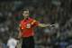 Referee Mark Clattenburg in action during a Champions League quarterfinal first leg soccer match between Real Madrid and Borussia Dortmund at the Santiago Bernabeu stadium in Madrid, Spain, Wednesday April 2, 2014. (AP Photo/Paul White)