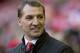 Liverpool's manager Brendan Rodgers smiles as he takes to the touchline before his team's English Premier League soccer match against Swansea City at Anfield Stadium, Liverpool, England, Sunday Feb. 23, 2014. (AP Photo/Jon Super)