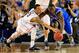 ARLINGTON, TX - APRIL 07: Shabazz Napier #13 of the Connecticut Huskies and Julius Randle #30 of the Kentucky Wildcats battle for a loose ball during the NCAA Men's Final Four Championship at AT&T Stadium on April 7, 2014 in Arlington, Texas. (Photo by Jamie Squire/Getty Images)