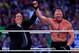 Paul Heyman, left, celebrates with Brock Lesnar after his win over the Undertaker during Wrestlemania XXX at the Mercedes-Benz Super Dome in New Orleans on Sunday, April 6, 2014. (Jonathan Bachman/AP Images for WWE)