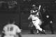 FILE - In this April 8, 1974 file photo, Atlanta Braves' Hank Aaron eyes the flight of the ball after hitting his 715th career homer in a game against the Los Angeles Dodgers in Atlanta. The 40th anniversary of Hank Aaron's 715th home run finds the Hall of Famer, now 80, coping with his recovery from hip surgery. The anniversary of his famous homer on April 8, 1974 will be celebrated before the Braves' home opener against the Mets on Tuesday night. (AP Photo/Harry Harrris, File)