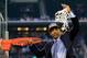 ARLINGTON, TX - APRIL 07: Head coach Kevin Ollie of the Connecticut Huskies cuts down the net after defeating the Kentucky Wildcats 60-54 in the NCAA Men's Final Four Championship at AT&T Stadium on April 7, 2014 in Arlington, Texas. (Photo by Jamie Squire/Getty Images)