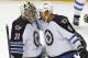 Winnipeg Jets goalie Ondrej Pavelec (31), of the Czech Republic, is congratulated by Winnipeg Jets wing Evander Kane (9) after a NHL hockey game against the Detroit Red Wings in Detroit, Tuesday, Nov. 12, 2013. Winnipeg won 3-2 in a shootout. (AP Photo/Paul Sancya)