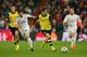 MADRID, SPAIN - APRIL 02: Henrikh Mkhitaryan of Borussia Dortmund goes past Xabi Alonso of Real Madrid during the UEFA Champions League Quarter Final first leg match between Real Madrid and Borussia Dortmund at Estadio Santiago Bernabeu on April 2, 2014 in Madrid, Spain. (Photo by Clive Rose/Getty Images)