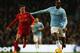 MANCHESTER, ENGLAND - DECEMBER 26: Yaya Toure of Manchester City is closed down by Joe Allen of Liverpool during the Barclays Premier League match between Manchester City and Liverpool at Etihad Stadium on December 26, 2013 in Manchester, England. (Photo by Jan Kruger/Getty Images)