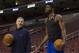 Philadelphia 76ers' head coach Brett Brown, left, works with Nerlens Noel, right, prior to the first half of an NBA basketball game against the Portland Trail Blazers, Saturday, Dec. 14, 2013, in Philadelphia. (AP Photo/Chris Szagola)