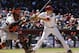 Arizona Diamondbacks' Chris Owings hits as San Francisco Giants catcher Hector Sanchez waits for a pitch out during the fourth inning of an MLB baseball game, Thursday, April 3, 2014,in Phoenix. (AP Photo/Matt York)