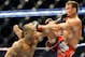 Hector Lombard lands a punch on Jake Shields during a UFC 171 mixed martial arts welterweight bout, Saturday, March. 15, 2014, in Dallas. Lombard won by decision. (AP Photo/Matt Strasen)