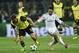 Dortmund's Erik Durm in action with Real's Daniel Carvajal during the Champions League quarterfinal second leg soccer match between Borussia Dortmund and Real Madrid in the Signal Iduna stadium in Dortmund, Germany, Tuesday, April 8, 2014. (AP Photo/Martin Meissner)