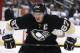 Pittsburgh Penguins' Sidney Crosby (87) prepares to take a face off during an NHL hockey game between the Pittsburgh Penguins and the Tampa Bay Lightning in Pittsburgh, Saturday, March 22, 2014. (AP Photo/Gene J. Puskar)