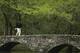 Phil Mickelson walks across the Byron Nelson Bridge during a practice round for the Masters golf tournament Tuesday, April 8, 2014, in Augusta, Ga. (AP Photo/Chris Carlson)