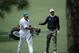 Adam Scott, of Australia, takes a club from his caddie Steve Williams on the seventh fairway during a practice round for the Masters golf tournament Tuesday, April 8, 2014, in Augusta, Ga. (AP Photo/Matt Slocum)