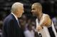 San Antonio Spurs guard Tony Parker, right, of France, talks to Spurs coach Gregg Popovich during the second half of an NBA basketball game against the Golden State Warriors, Wednesday, April 2, 2014, in San Antonio. San Antonio won 111-90. (AP Photo/Darren Abate)