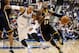 Indiana Pacers small forward Paul George (24) gets fouled by Dallas Mavericks' Shawn Marion (0) during the second half of an NBA game, Sunday, Mar. 9, 2014, in Dallas, Texas. The Dallas Mavericks won 105-94. (AP Photo/Jim Cowsert)