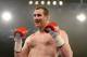 Britain's David Price celebrates after winning his heavyweight fight against Hungary's Istvan Ruzsinszky in Stuttgart, Germany, Saturday, Jan. 25, 2014. (AP Photo/Daniel Kopatsch)