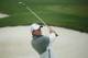 Rory McIlroy, of Northern Ireland, watches his chip shot while on the practice range in preparation for the Masters golf tournament Monday, April 7, 2014, in Augusta, Ga. (AP Photo/Matt Slocum)