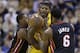 Indiana Pacers forward Paul George, center, is trapped by Miami Heat forward LeBron James, right, and guard Mario Chalmers in the first half of an NBA basketball game in Indianapolis, Tuesday, Dec. 10, 2013. (AP Photo/Michael Conroy)