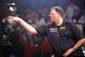 Netherland's Raymond Van Barneveld throws a dart during the final of the World Professional Darts Championships against Netherland's Jelle Klaasen at the Lakeside Country Club, Frimley Green, England , Sunday Jan. 15, 2006. (AP Photo/Tom Hevezi)