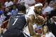 Miami Heat forward LeBron James, right, looks for an open teammate past Brooklyn Nets guard Joe Johnson (7) during the first half of an NBA basketball game, Wednesday, March 12, 2014, in Miami. (AP Photo/Wilfredo Lee)