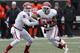 Oklahoma quarterback Trevor Knight (9) hands off to running back Brennan Clay (24) during an NCAA college football game between Oklahoma State and Oklahoma in Stillwater, Okla., Saturday, Dec. 7, 2013. (AP Photo/Sue Ogrocki)