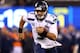 EAST RUTHERFORD, NJ - FEBRUARY 02: Quarterback Russell Wilson #3 of the Seattle Seahawks runs the ball against the Denver Broncos during Super Bowl XLVIII at MetLife Stadium on February 2, 2014 in East Rutherford, New Jersey. (Photo by Elsa/Getty Images)