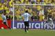 Argentina's Sergio Aguero, left, prepares to score a penalty as Ecuador's goalkeeper Alexander Dominguez looks on during a 2014 World Cup qualifying soccer match in Quito, Ecuador, Tuesday, June 11, 2013. (AP Photo/Dolores Ochoa)