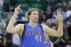 Dallas Mavericks' Dirk Nowitzki (41) celebrates his 3 pointer in the second half during an NBA basketball game against the Utah Jazz Tuesday, April 8, 2014, in Salt Lake City. (AP Photo/Rick Bowmer)