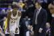 Indiana Pacers head coach Frank Vogel, right talks with forward Paul George in the second half of an NBA basketball game against the Sacramento Kings in Indianapolis, Tuesday, Jan. 14, 2014. The Pacers defeated the Kings 116-92. (AP Photo/Michael Conroy)