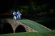 AUGUSTA, GA - APRIL 09: Mark O'Meara of the United States and Hideki Matsuyama of Japan walk with their caddies over the Hogan Bridge during a practice round prior to the start of the 2014 Masters Tournament at Augusta National Golf Club on April 9, 2014 in Augusta, Georgia. (Photo by Rob Carr/Getty Images)
